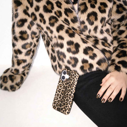 Leopard print jacket with fur trim and a visible brand logo on a white background